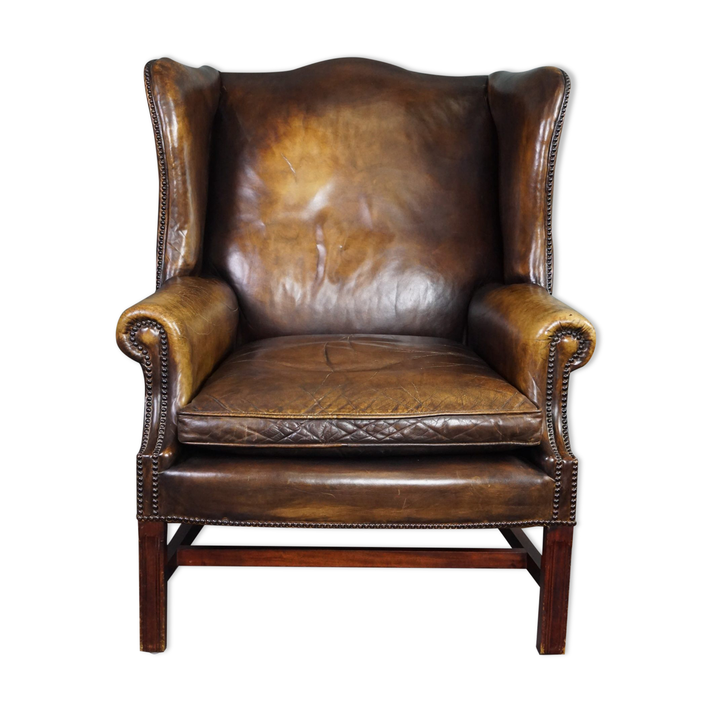 Patinated cowhide leather armchair