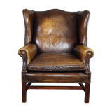 Patinated cowhide leather armchair