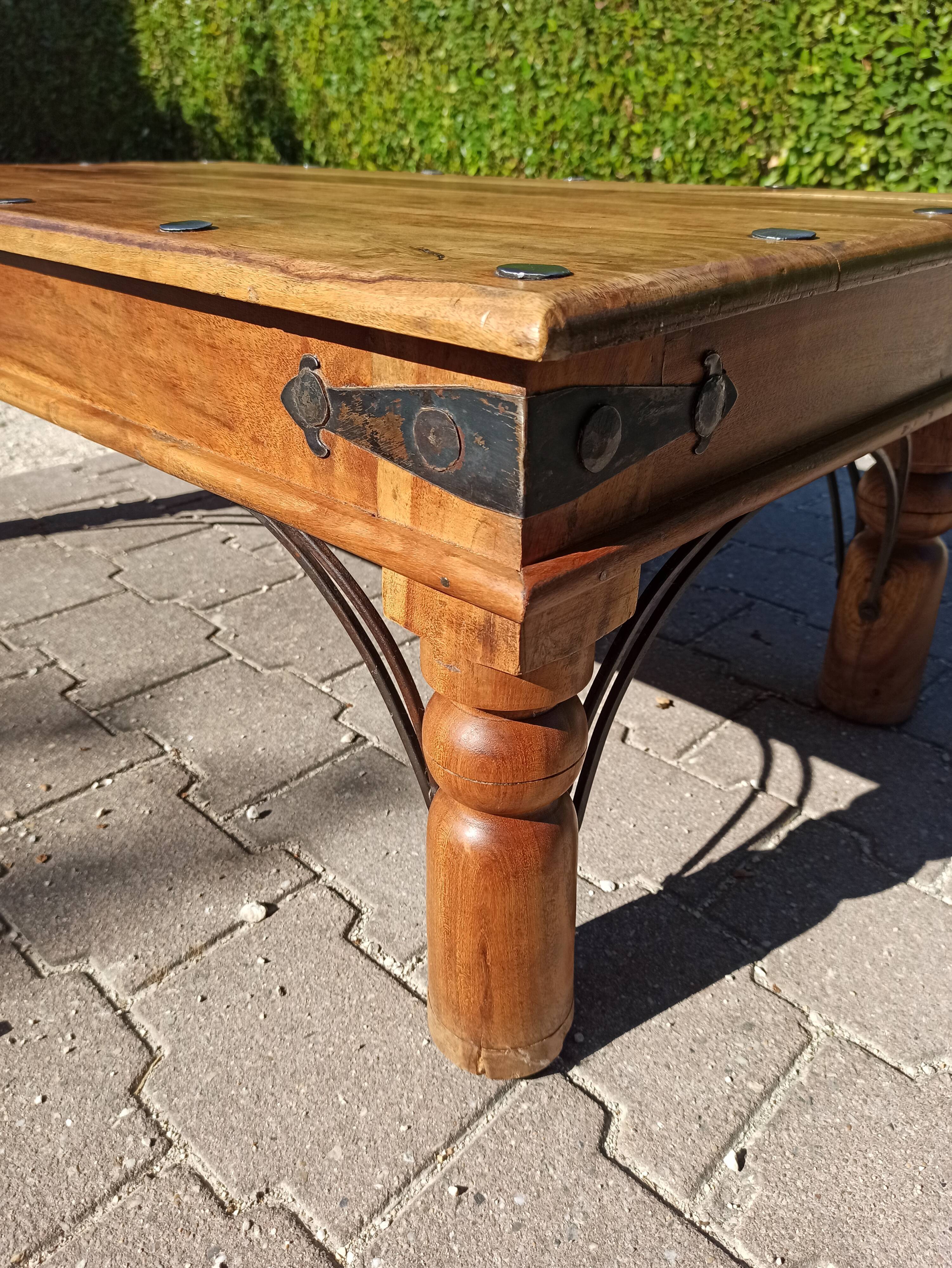 Medieval-inspired red oak coffee table with ironwork