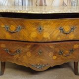 Curved Louis XV style commode with floral marquetry and marble top.