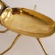 Empty vintage pocket in the shape of a brass insect