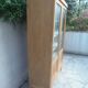 Charming vintage display cabinet from the 1950s in natural wood.
