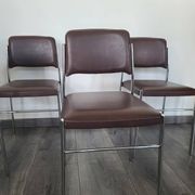 Set of 4 brown leatherette armchair chairs from the 1970s