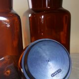 Duo of vintage apothecary bottles in amber glass