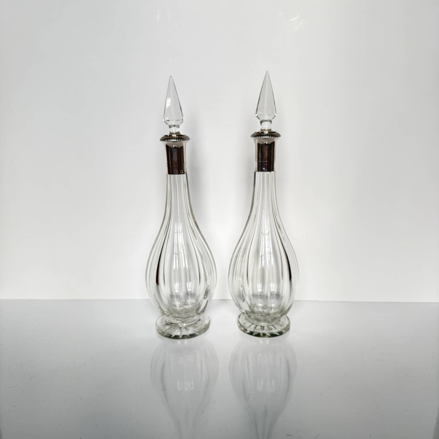 Pair of crystal decanters with solid silver mounts