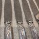 12 silver-plated dessert knives by St Medard, rocaille style, Florian.