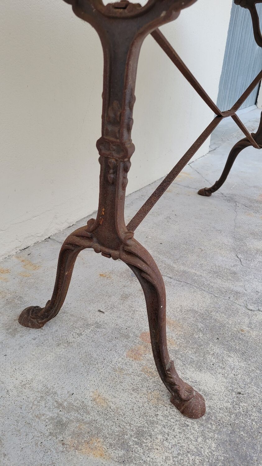 Restaurant bistro table in oval marble and decorated cast iron bases -1m51