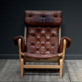 A Pernilla 69 leather lounge chair by Bruno Mathsson for Dux, 1969