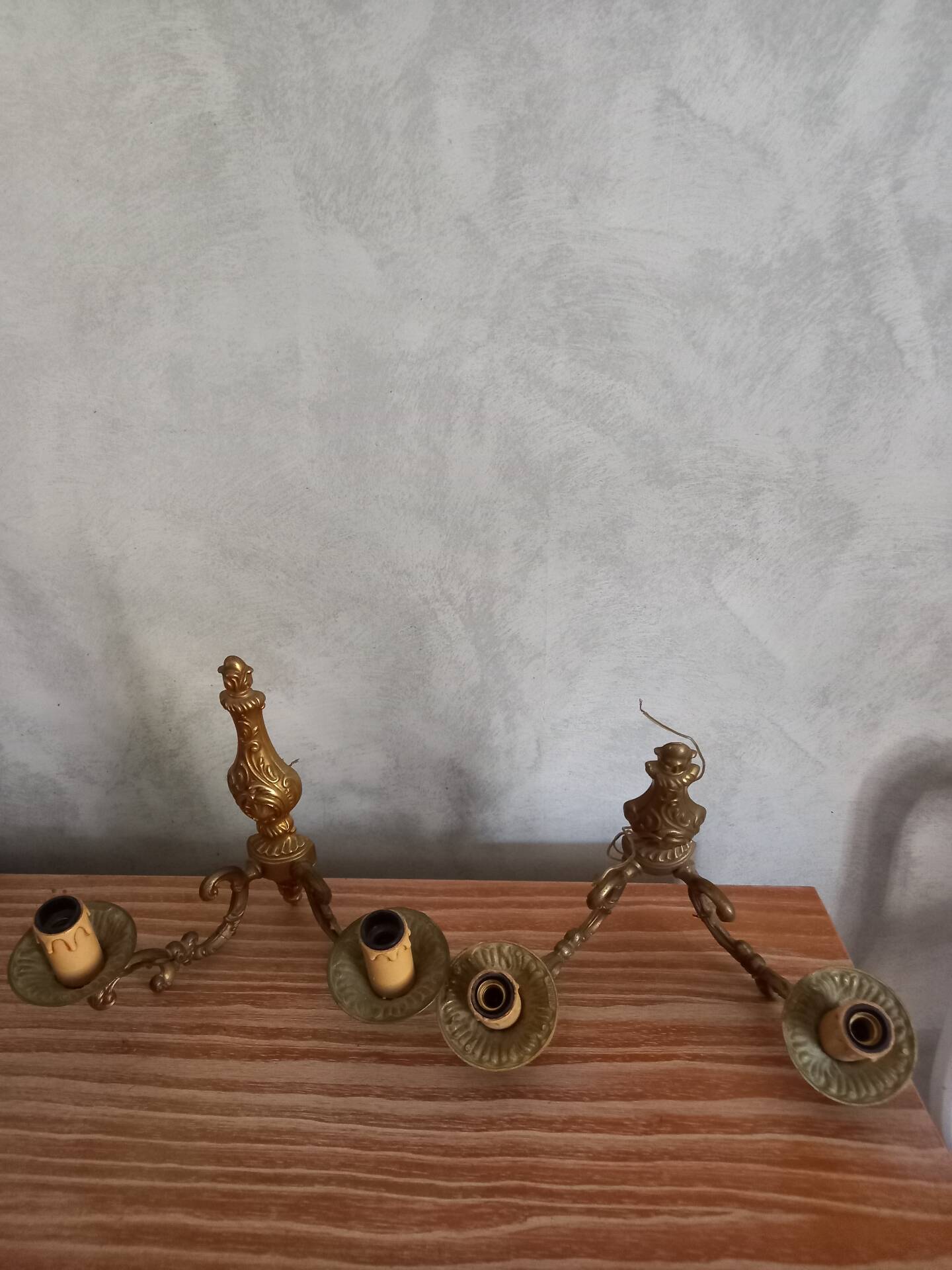 Old pairs of bronze wall sconces