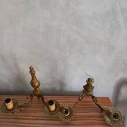 Old pairs of bronze wall sconces