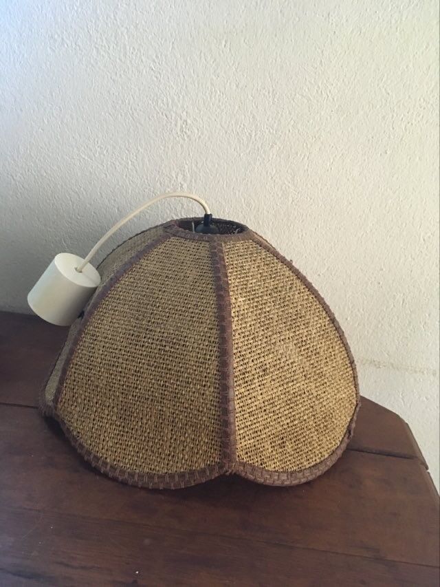 Two-tone flower hanging in braided straw.