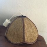 Two-tone flower hanging in braided straw.