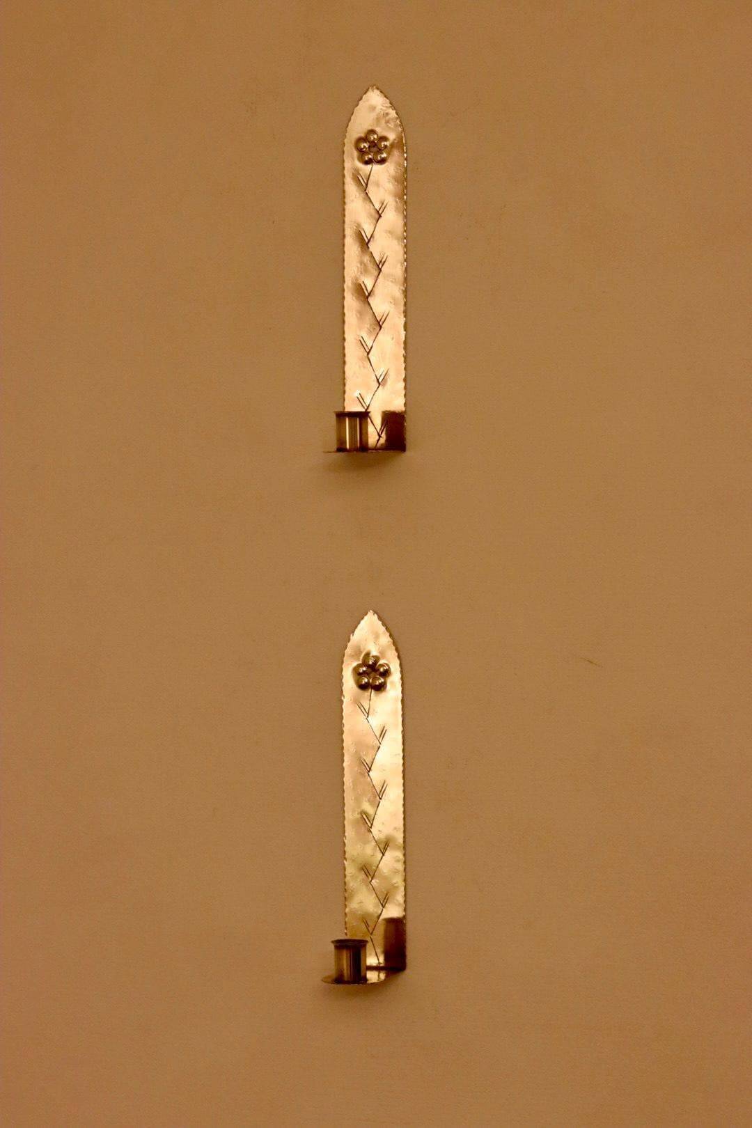 A pair of Swedish brass wall sconces from the mid-century.
