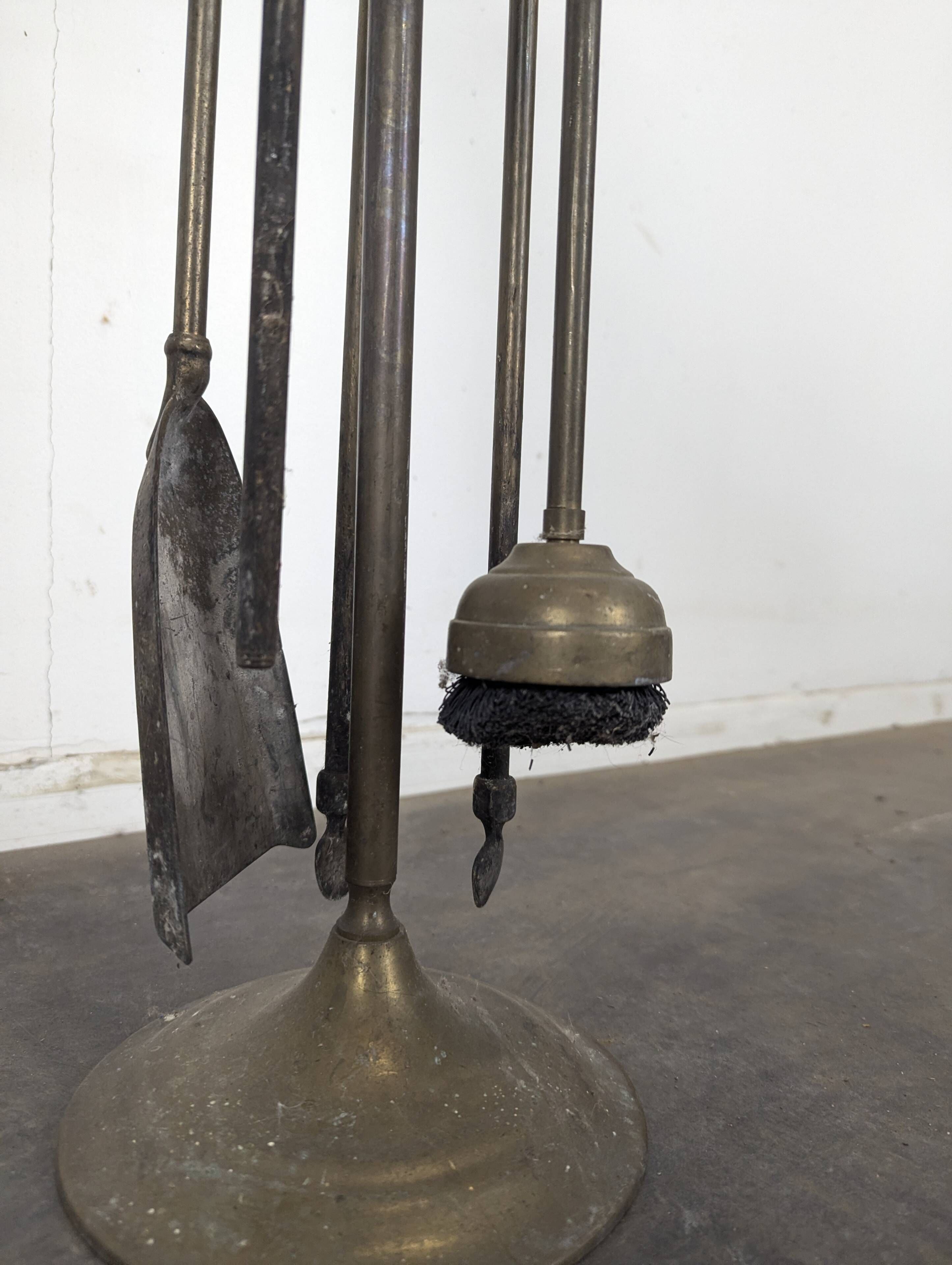 Brass fireplace tool set with four accessories