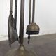 Brass fireplace tool set with four accessories