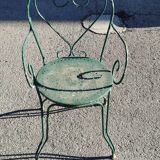 Garden table, two armchairs and a metal chair