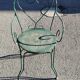 Garden table, two armchairs and a metal chair