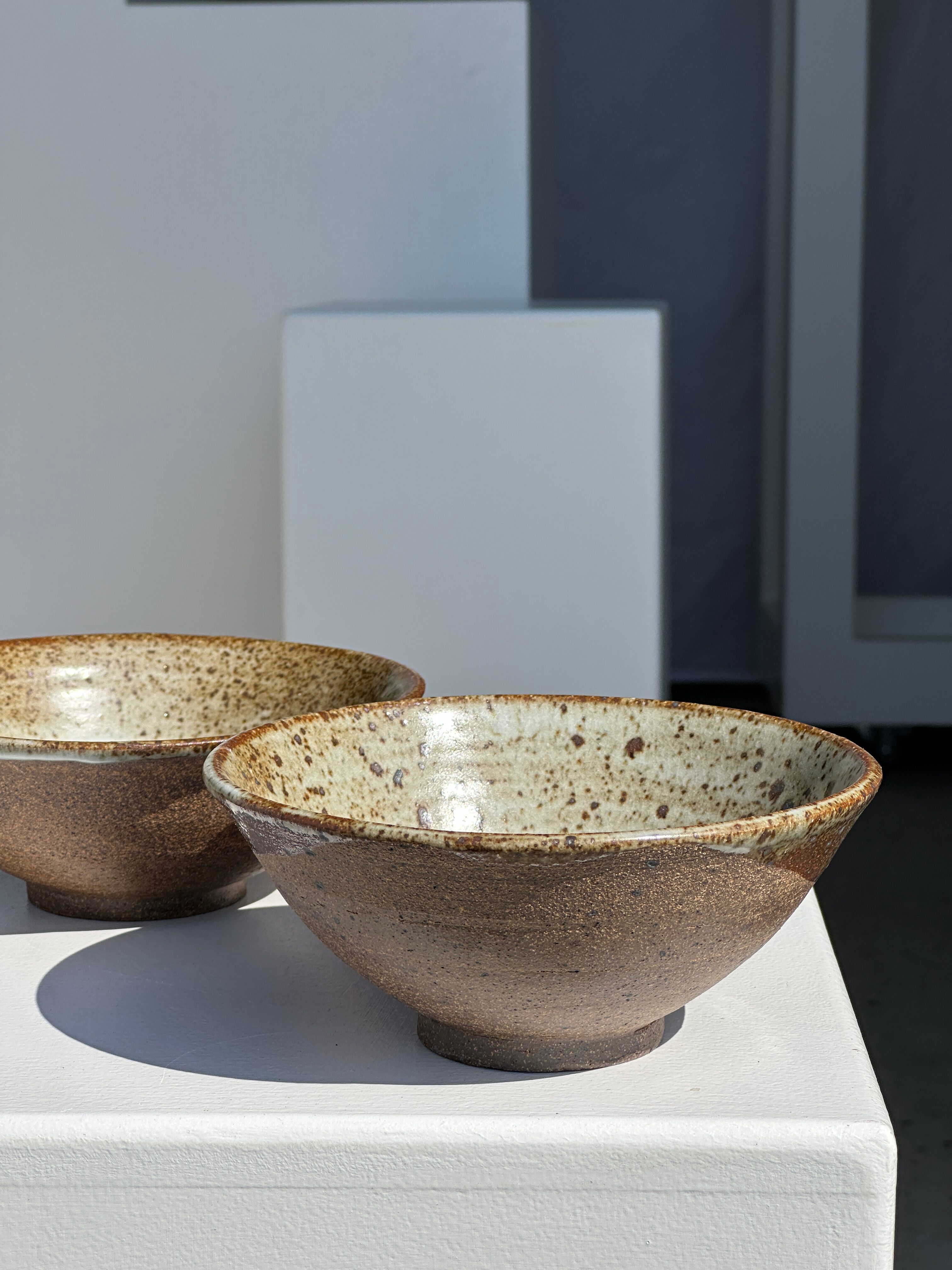 Duo of ceramic bowls interior glazed exterior matt raw earth