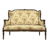 Banquette à oreilles de style Louis XVI en bois sculpté vers 1850