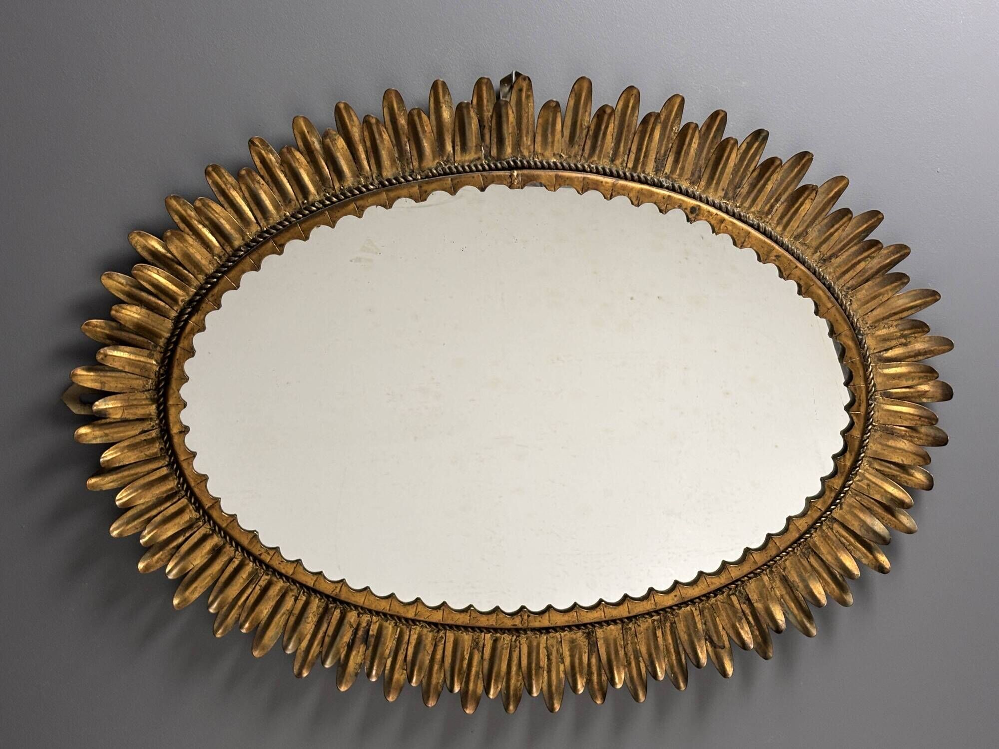 Midcentury bohemian Hollywood Regency Spanish gilt metal sun mirror, 1960s