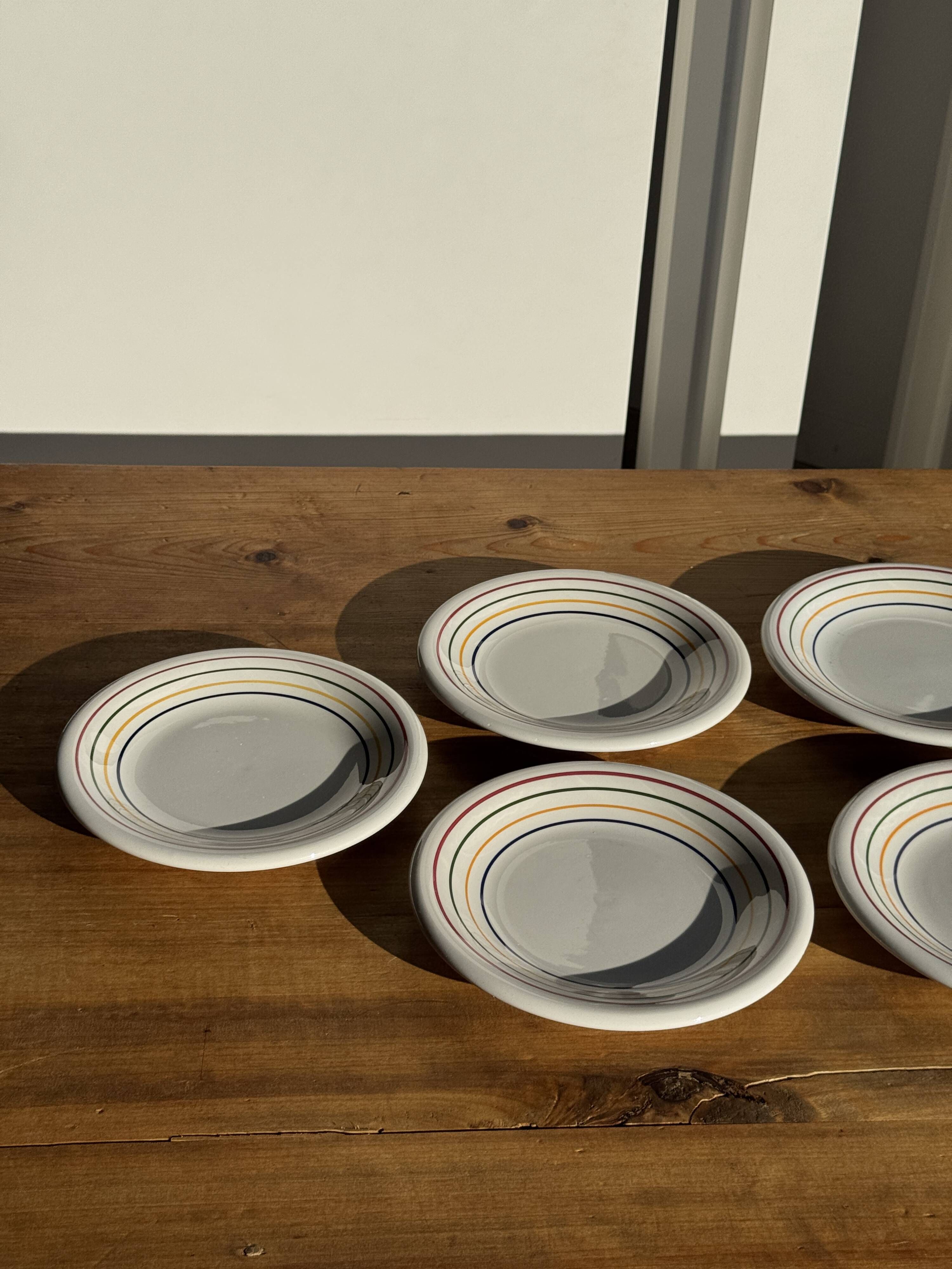 Set of 9 small Italian dessert plates Primula with red and green trim.