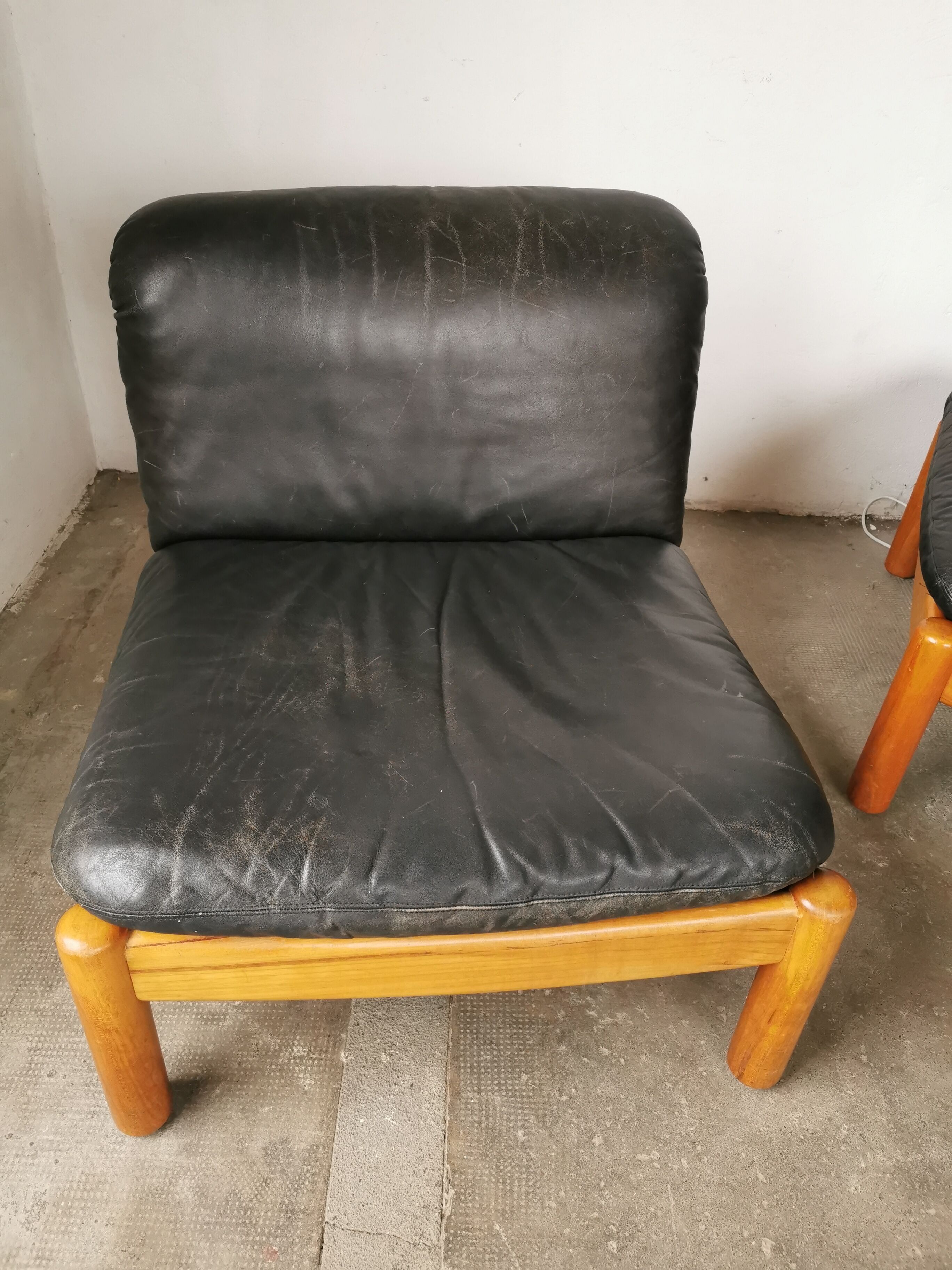 Pair of designer leather armchairs 80s