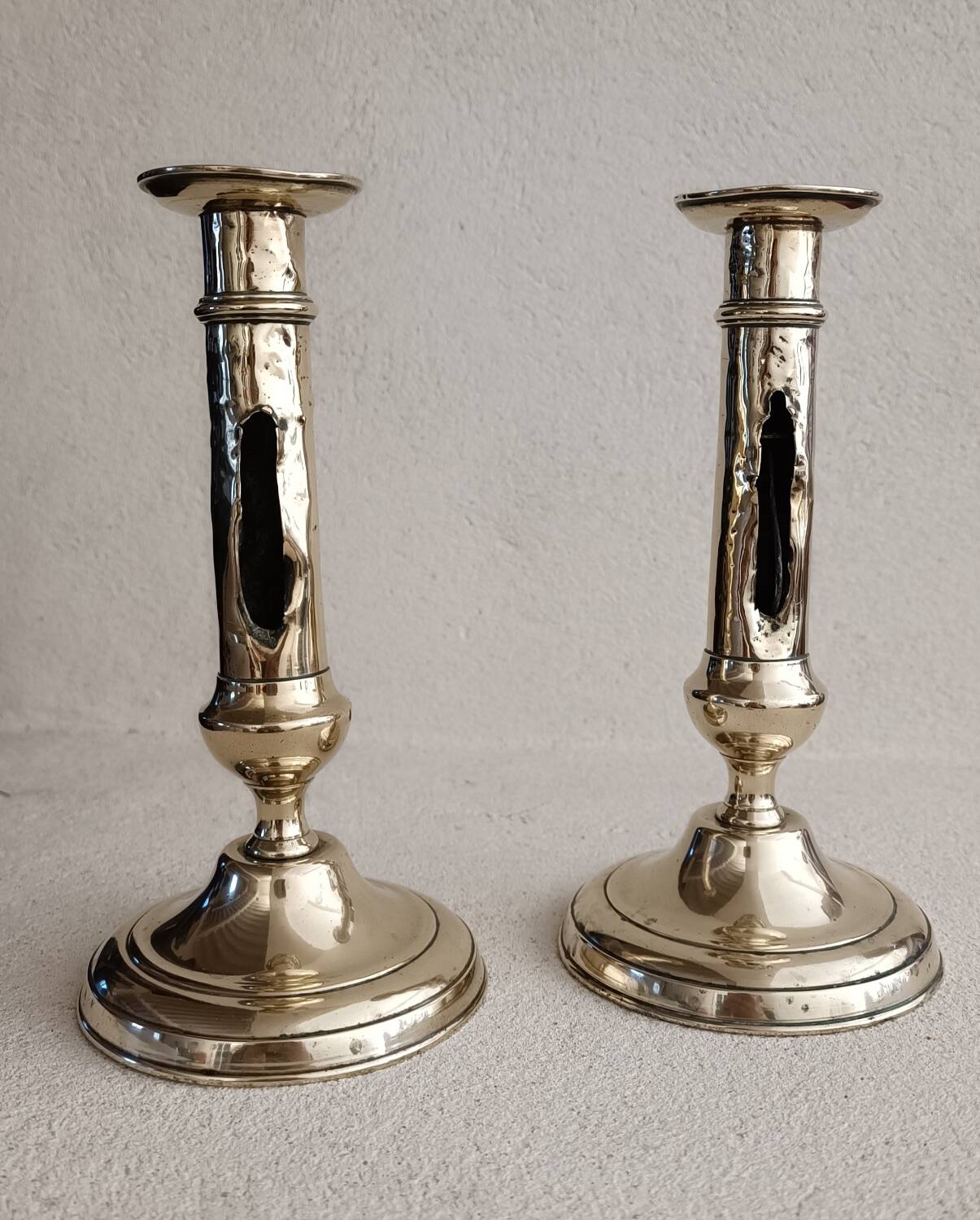 Pair of yellow copper candlesticks