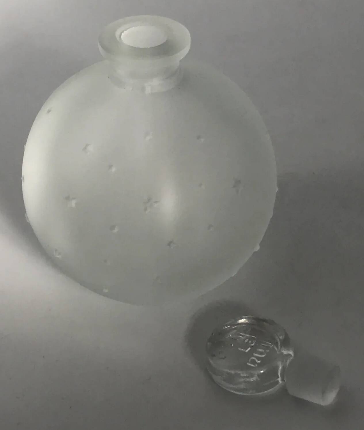 Lalique bottle in the night, frosted glass, ball shape