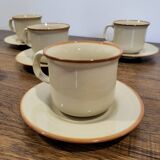 5 enameled stoneware cups and saucers