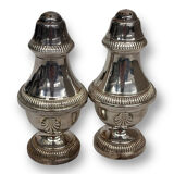 Salt shaker and pepper shaker in silver metal