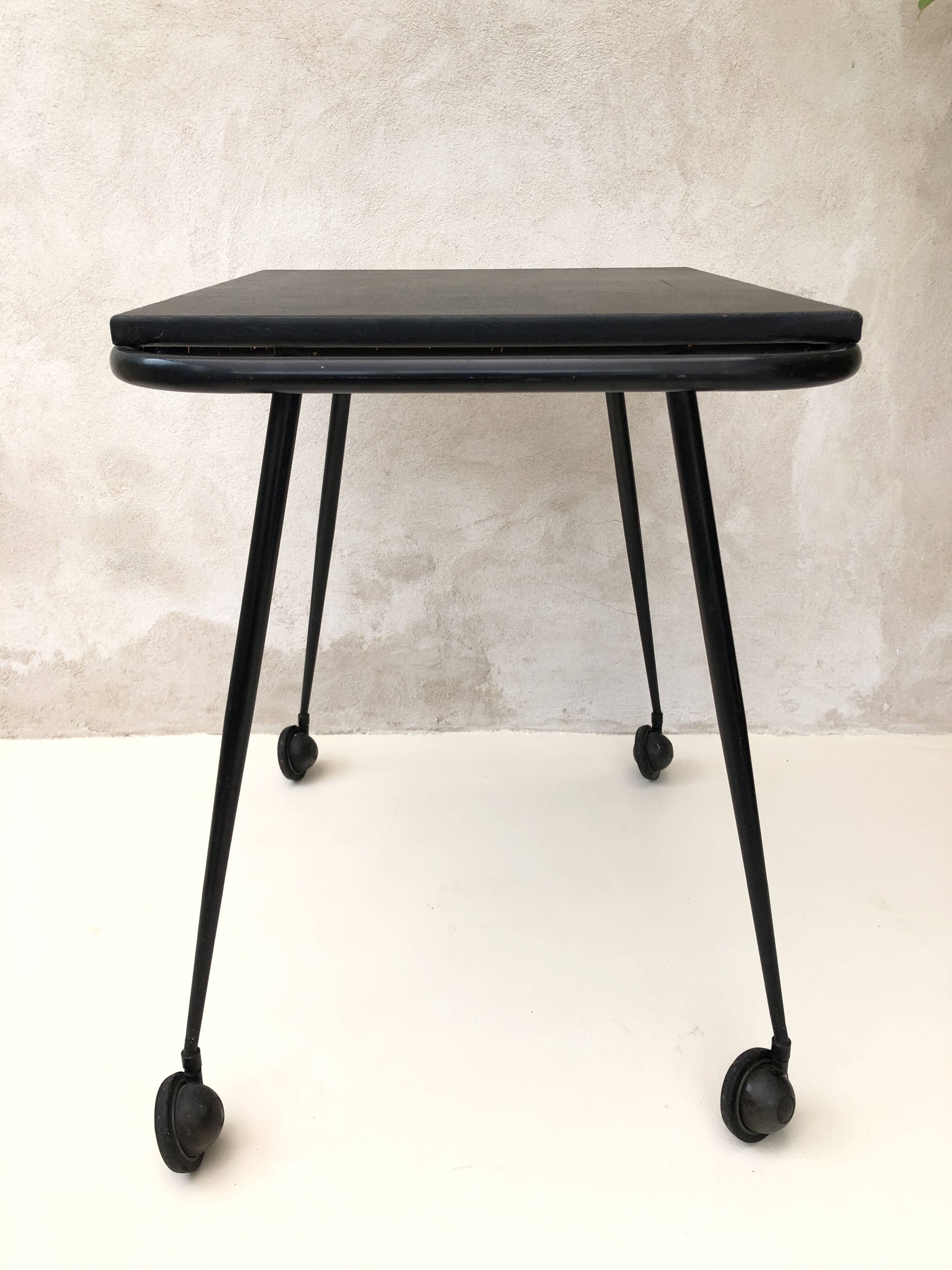 Black table on wheels from the 60s