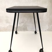 Black table on wheels from the 60s