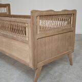 Children's bed in wood and sandblasted rattan from the 1960s.