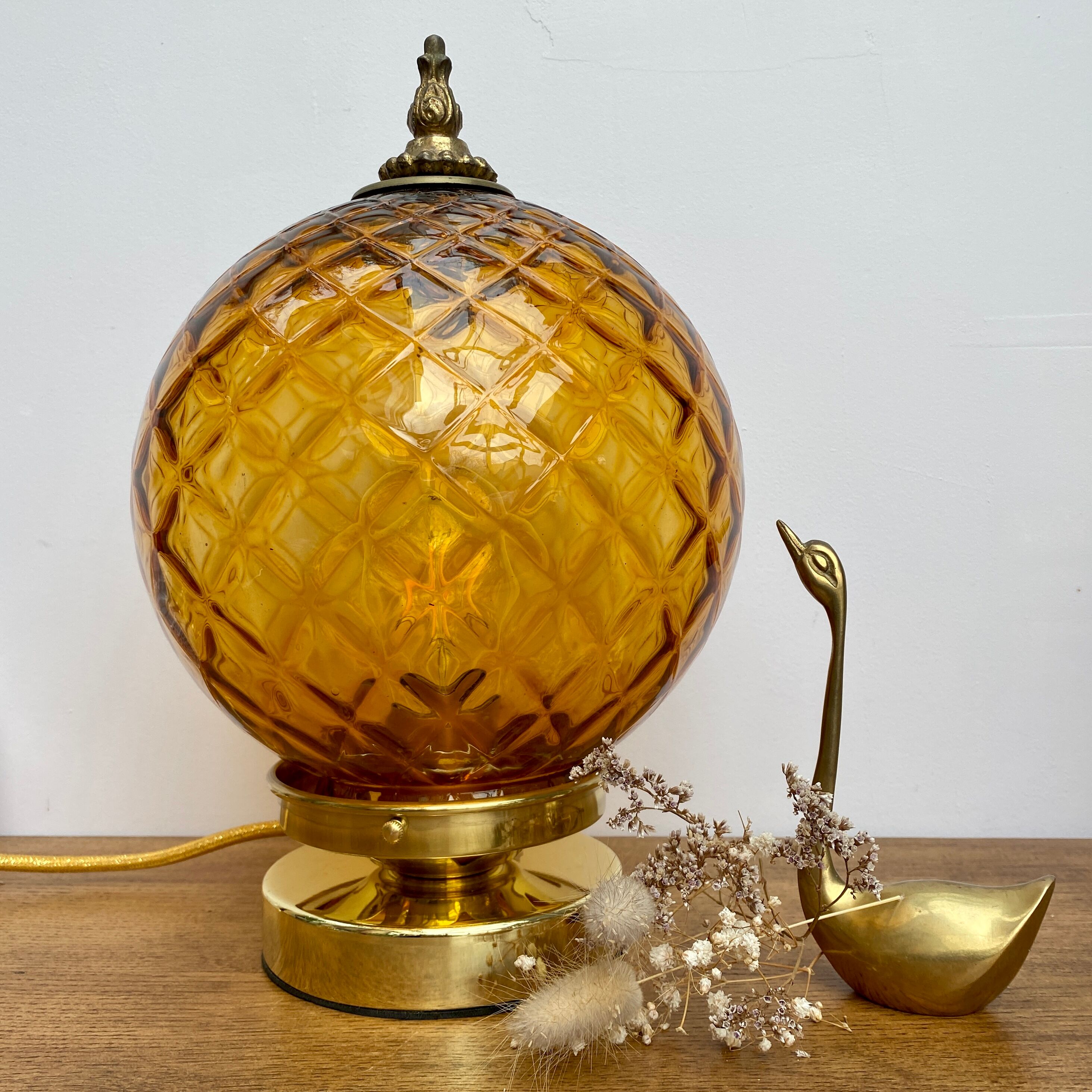 Vintage amber glass globe laying lamp with brass detail