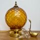 Vintage amber glass globe laying lamp with brass detail