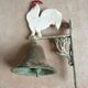 Cloche de porte en fonte