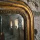 Antique French Louis Philippe mirror, gilded mercury mirror, 19th century.