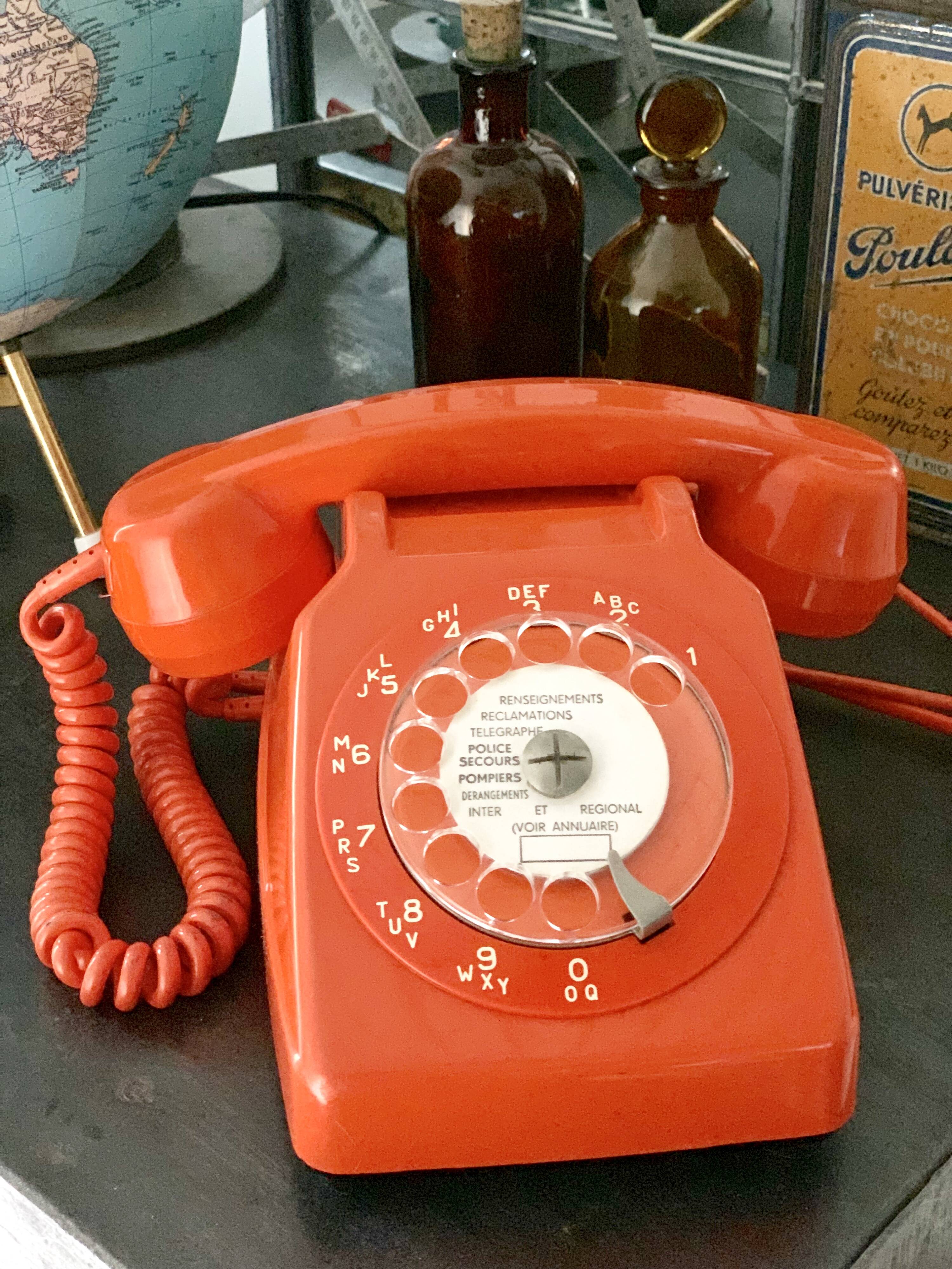 Old orange vintage dial phone