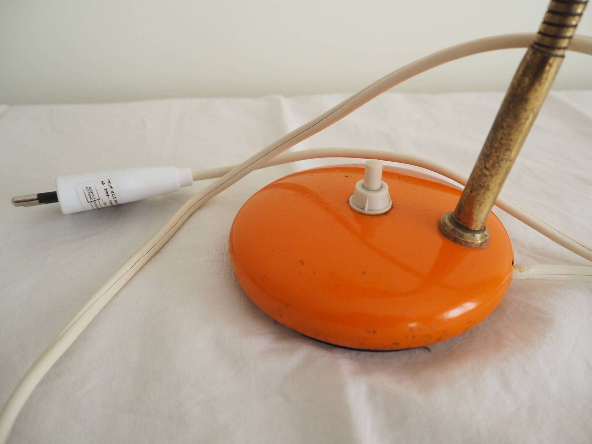 Orange colored metal desk lamp from the 1960s-1970s