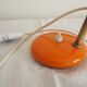 Orange colored metal desk lamp from the 1960s-1970s