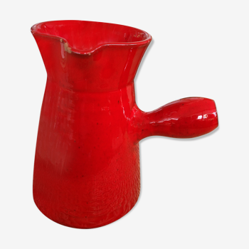 Ancient pitcher in red enamelled sandstone