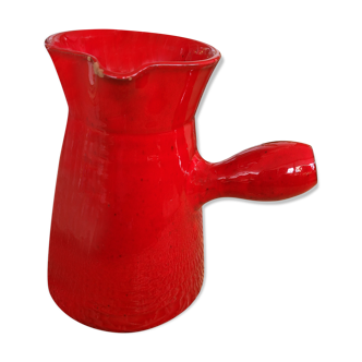 Ancient pitcher in red enamelled sandstone