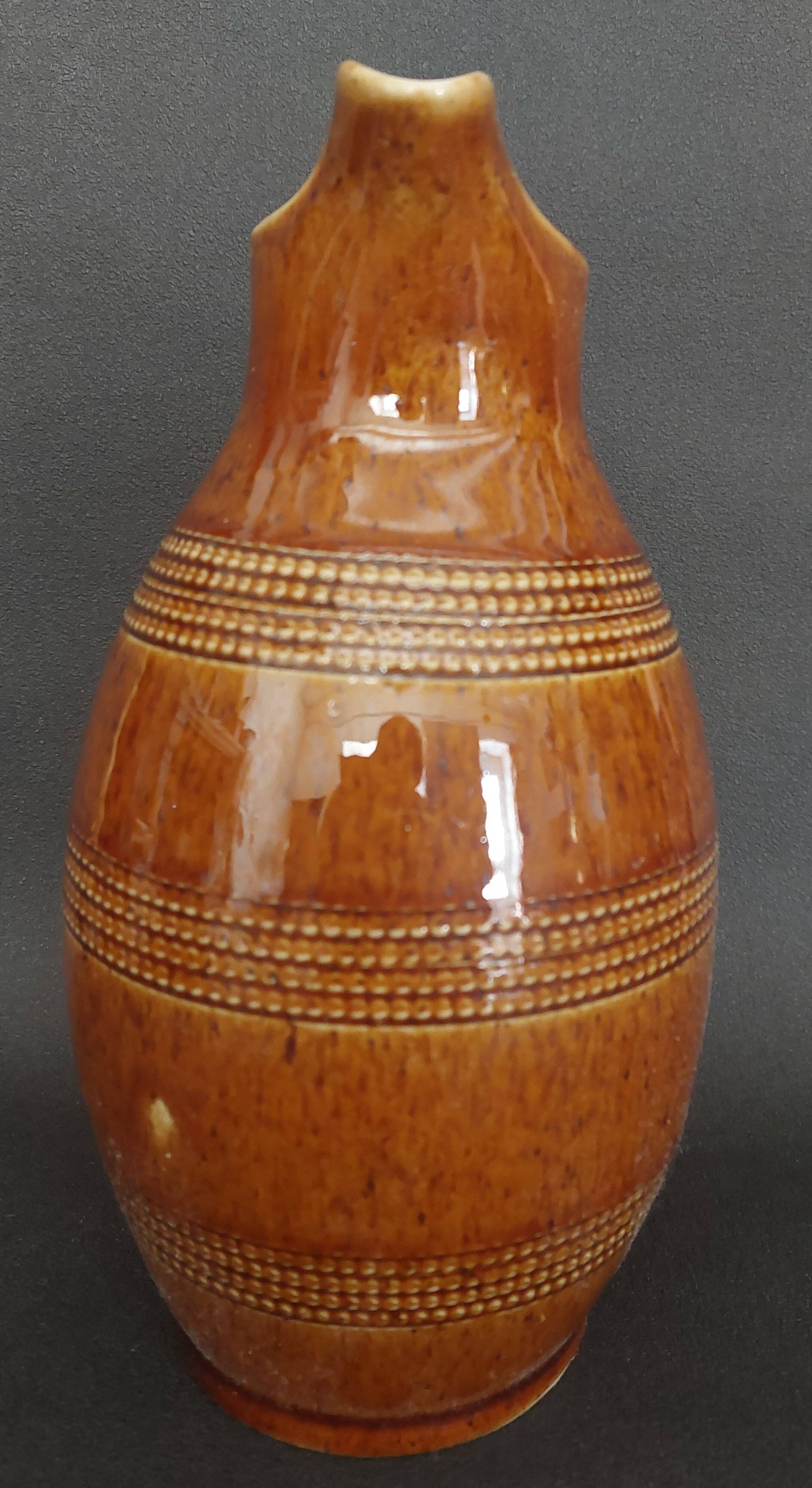 Mid-20th century brown glazed stoneware wine pitcher