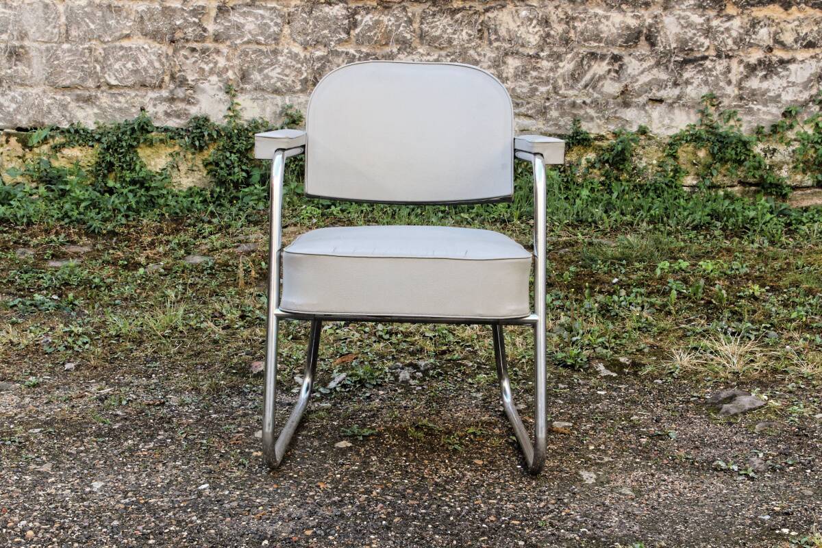 Set of 2 chairs and 1 armchair from the 70s in chrome metal and faux leather.