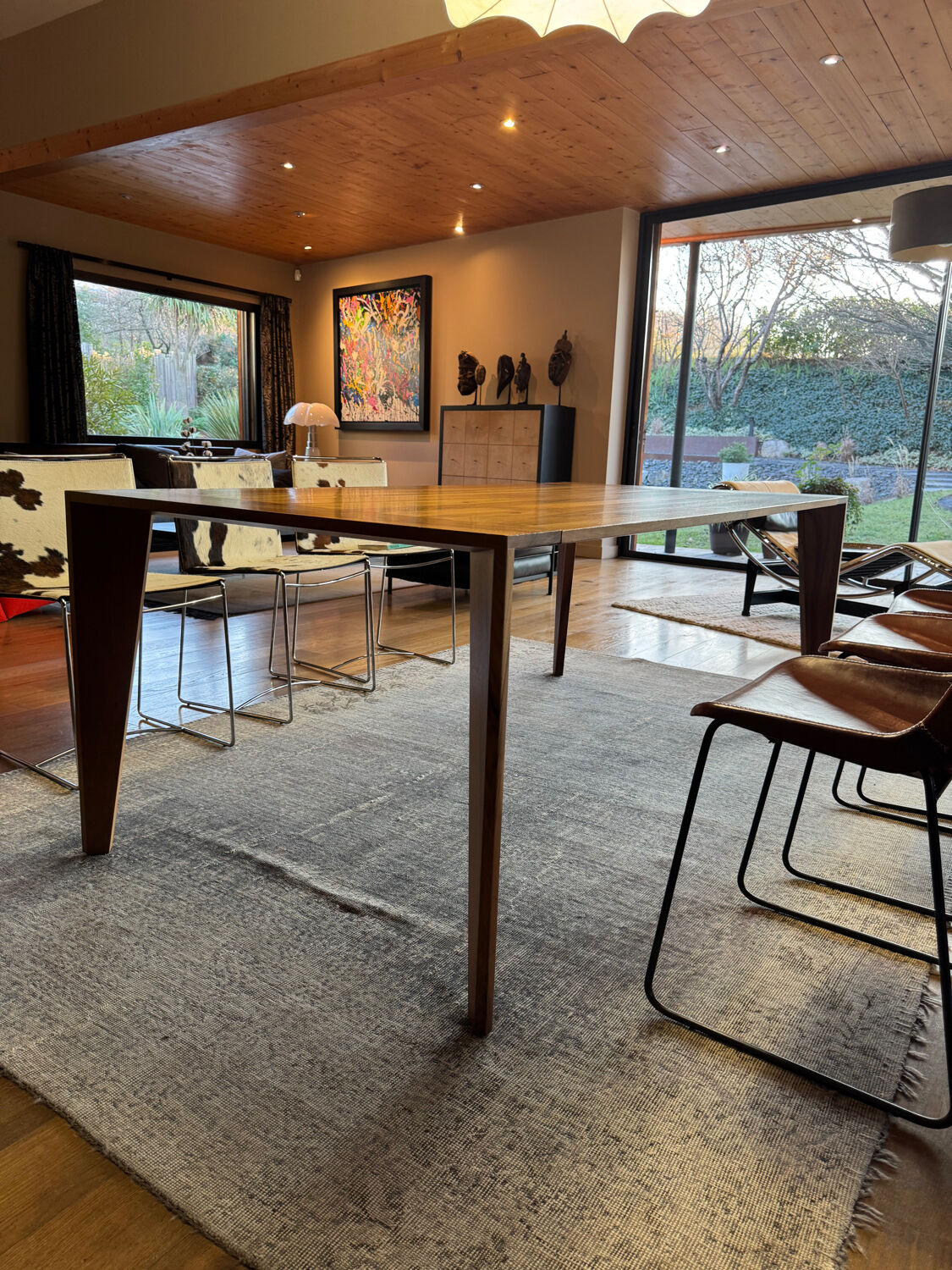 Dining table ligne roset model trapèze in solid walnut with oil finish.
