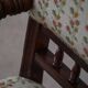 Modern Danish armchair in turned wood with floral fabric, early 20th century.