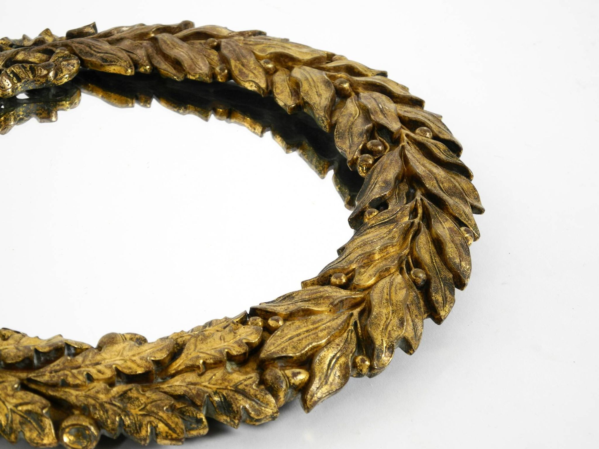 Beautiful small French mid-century wall mirror with an ornate brass frame