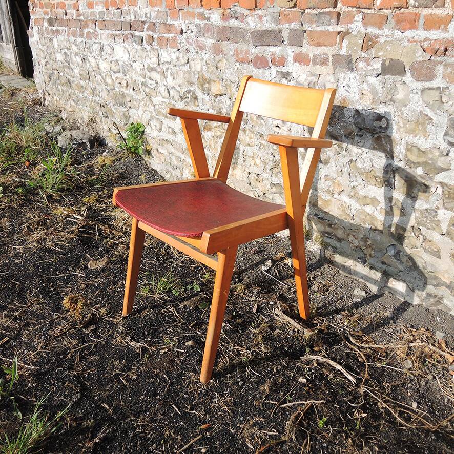 Old wooden and red leatherette bridge chair