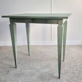 Green side table with tapered legs