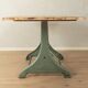 Unique dining table with cast iron base and solid wood top